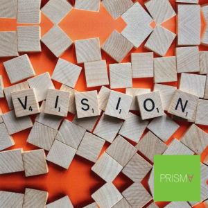 Scrabble pieces spelling "vision" - Create your won vision board.