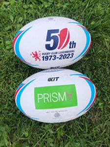 The new balls of Rugby Club de Luxembourg with the Prisma logo.