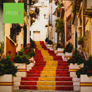 Stairs in a narrow street painted in the colours of the Spanish flag.